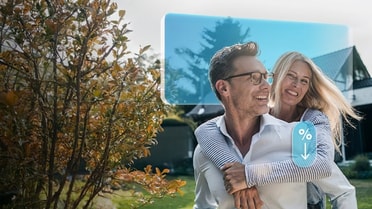 Happy couple outside their new home
