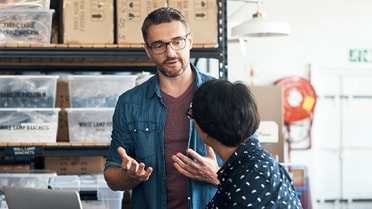 Man talking to woman