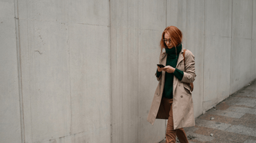 Woman walking down the street on phone