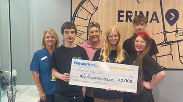 Ngaruki Gulgul Central School receiving cheque for community funding program win