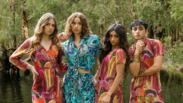 Facon women in bright colorful gowns