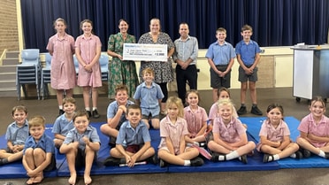 Eugowra’s homework club posing with 3 thousand dollar cheque 