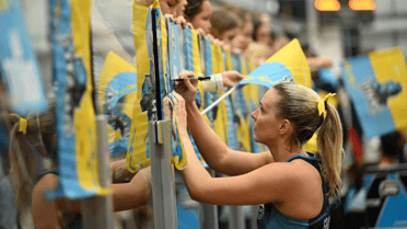 Gold Coast Titans Netball player signing jersey