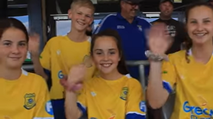 Soccer fans waving to camera