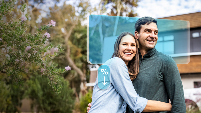 Couple standing outside their new property